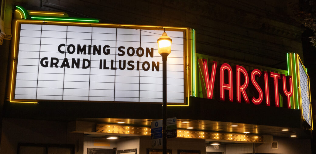 The marquee of the Varsity Theatre, with the message COMING SOON: GRAND ILLUSION