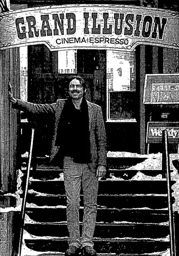 Paul Doyle standing on the entry steps to the Grand Illusion Cinema